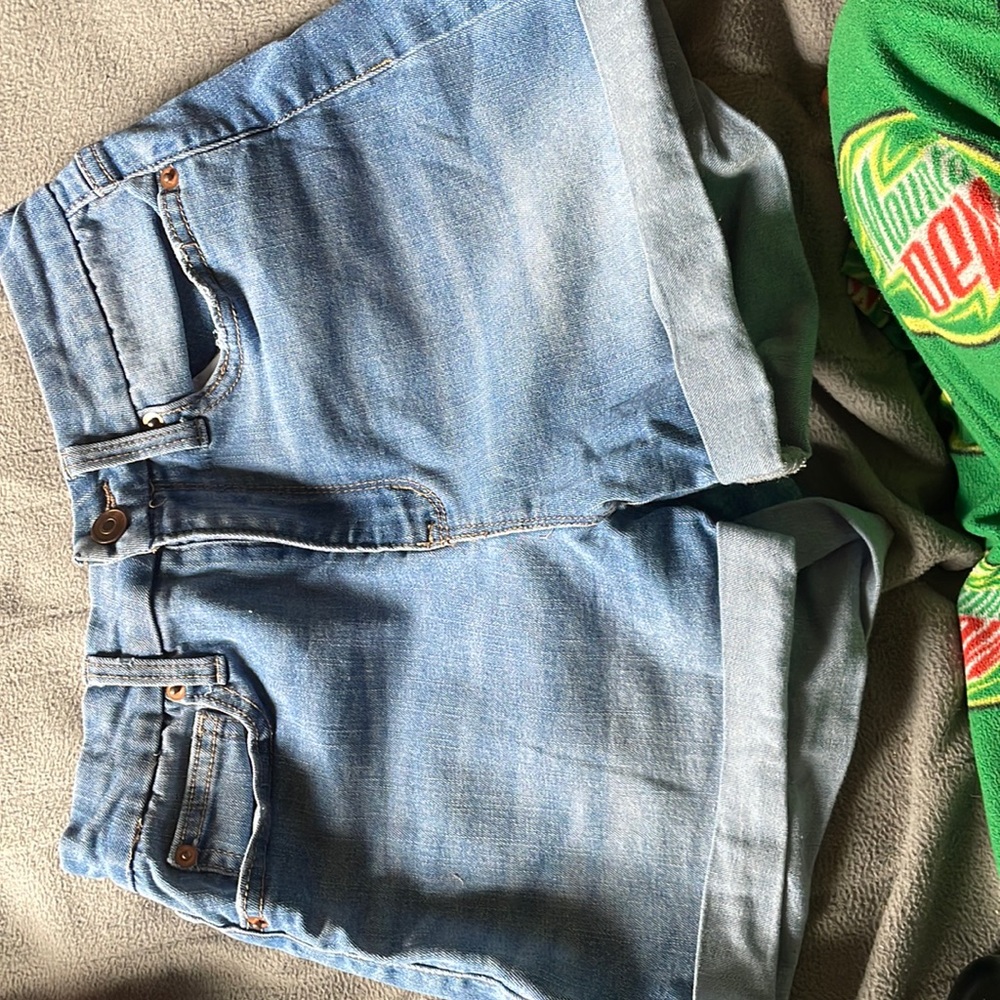 Blue jeans with roles on the bottom